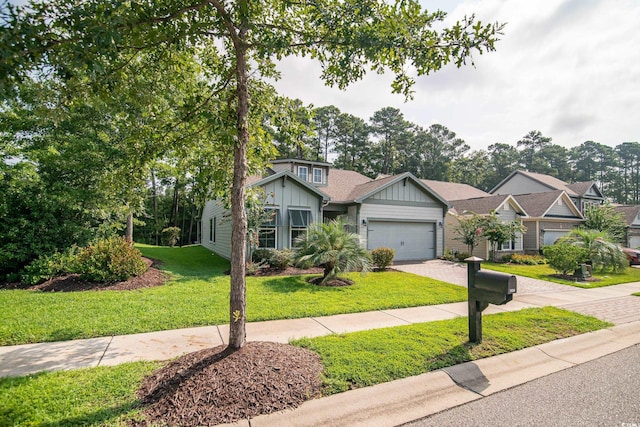 view of front of home with a garage and a front yard