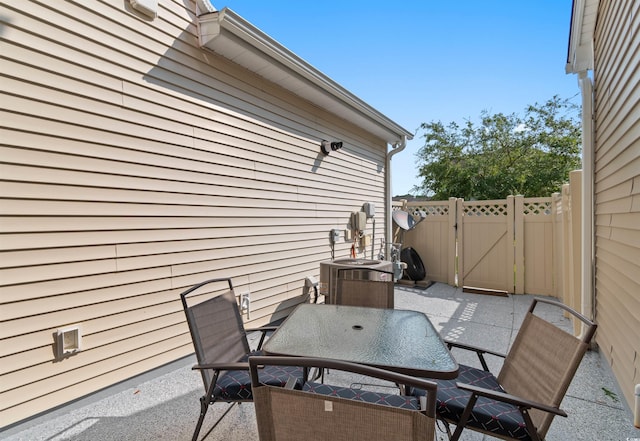 444 Papyrus Cir Unit 444, Little River, SC 29566 - view of patio featuring a gate and outdoor dining area