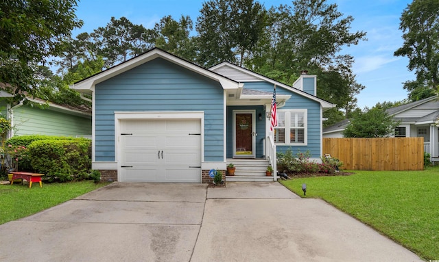 view of front facade with a front lawn and a garage