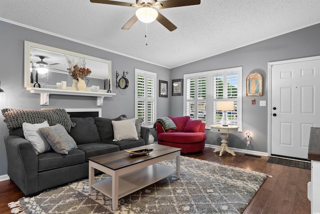 living room featuring ceiling fan, dark wood-type flooring, ornamental molding, vaulted ceiling, and a textured ceiling