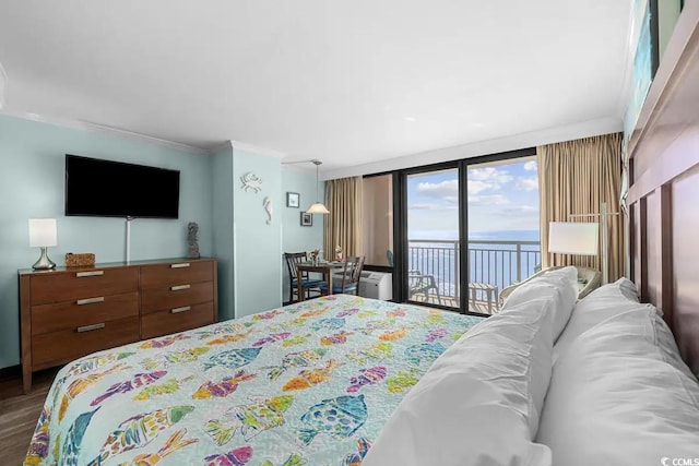 bedroom with crown molding, floor to ceiling windows, a water view, dark wood-type flooring, and access to exterior