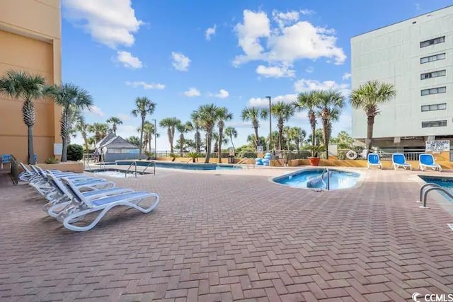 view of swimming pool with a patio