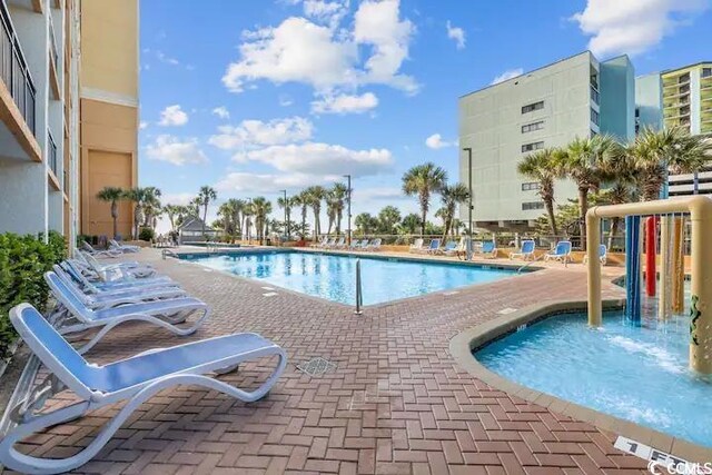 view of pool featuring a patio