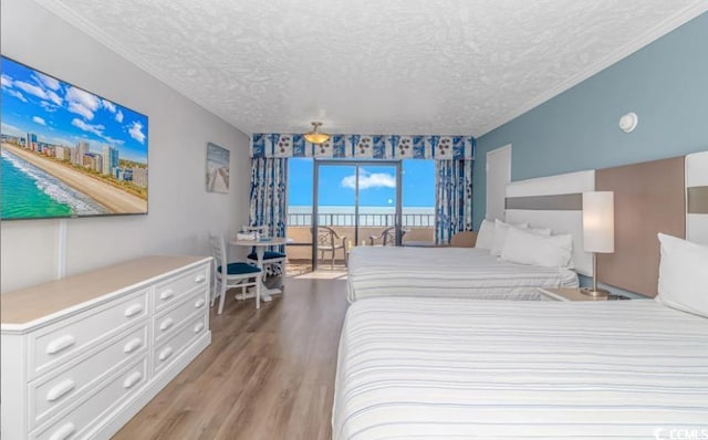 bedroom featuring a textured ceiling and hardwood / wood-style floors