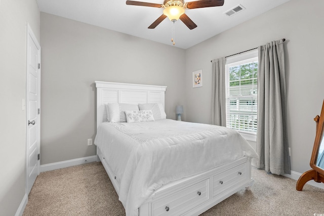 bedroom featuring light carpet and ceiling fan