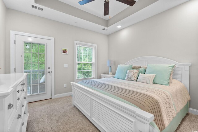 carpeted bedroom featuring access to outside and ceiling fan