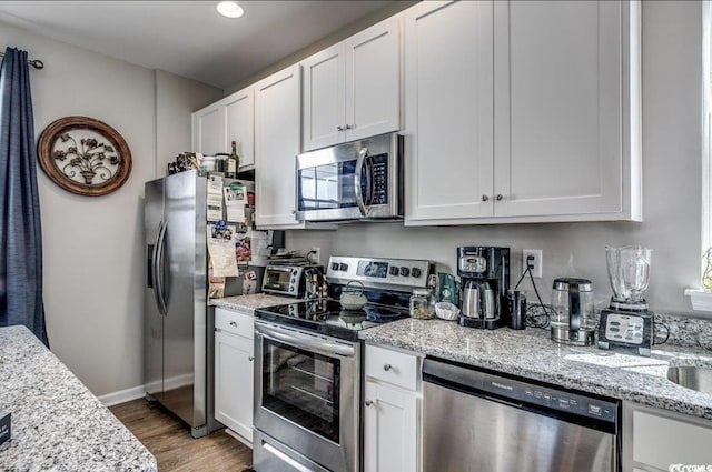 3507 Fountain Ln, Myrtle Beach, SC 29577 - kitchen featuring white cabinets and appliances with stainless steel finishes