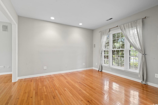 spare room with light hardwood / wood-style flooring