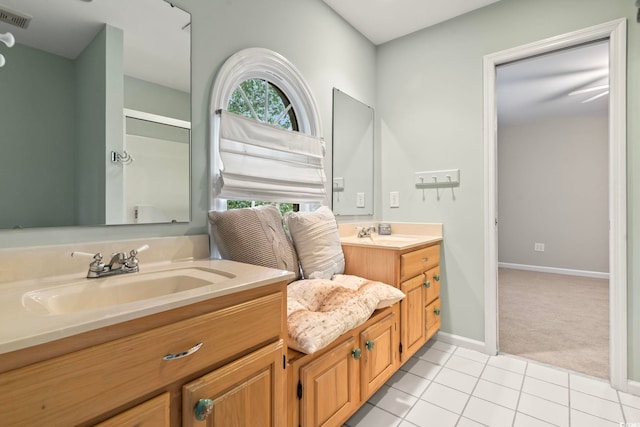 bathroom with tile patterned flooring and vanity