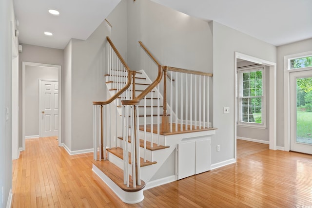 stairs featuring hardwood / wood-style flooring