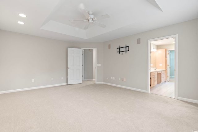 hall with light colored carpet