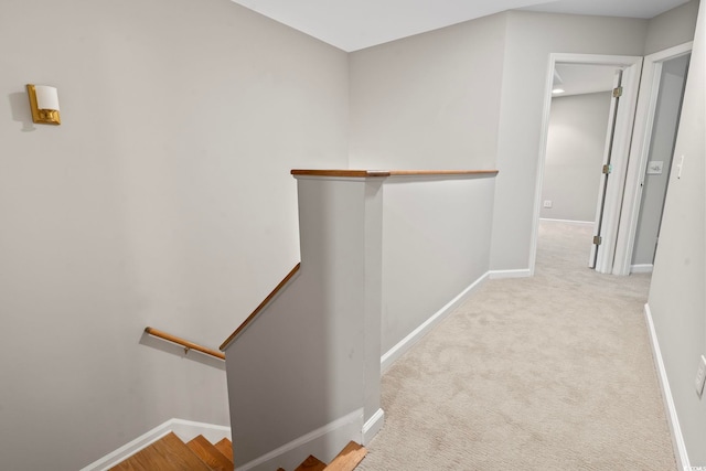 bonus room featuring lofted ceiling, ceiling fan, and light carpet