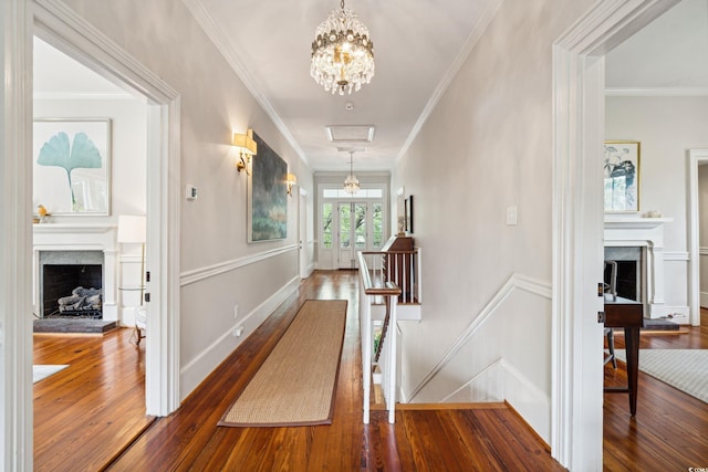 hallway featuring crown molding and hardwood / wood-style floors