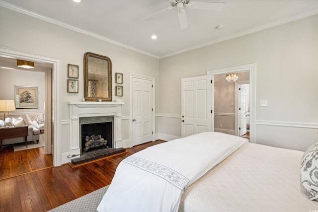 bedroom with ceiling fan, crown molding, and dark hardwood / wood-style floors