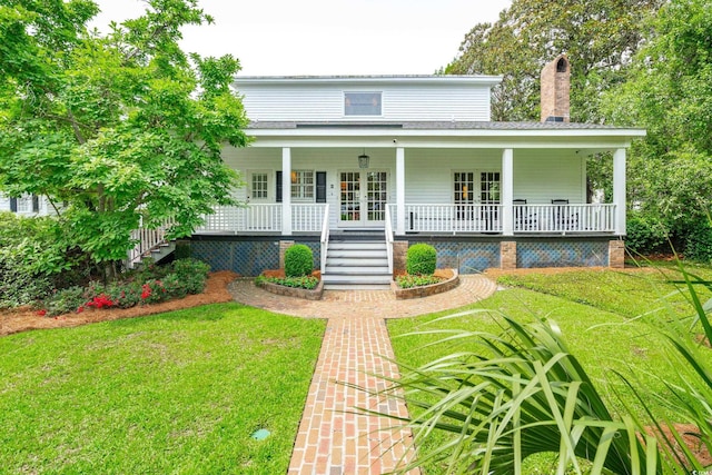 farmhouse-style home with a front yard and a porch