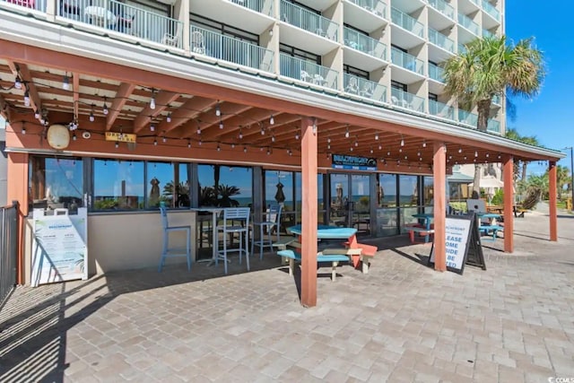 view of patio featuring a balcony