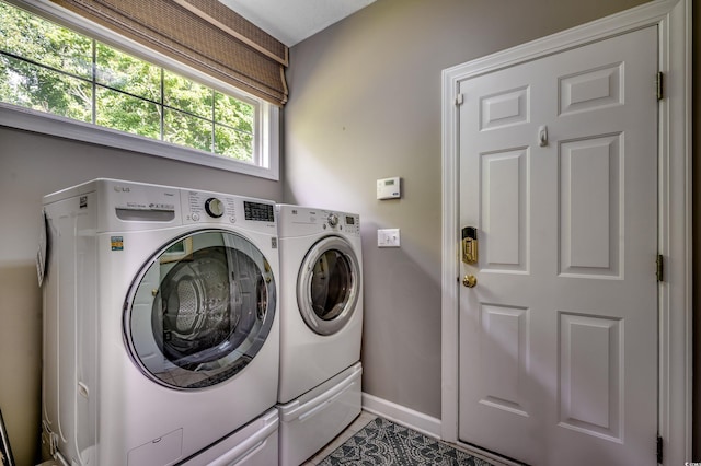 laundry room featuring washing machine and dryer