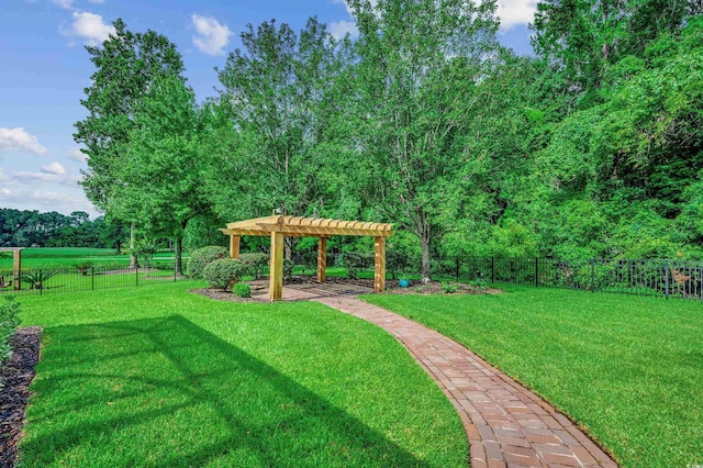 view of property's community featuring a pergola, a lawn, and a patio