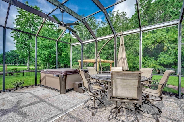 view of patio with a hot tub and a lanai