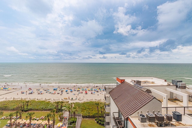 aerial view with a water view and a view of the beach