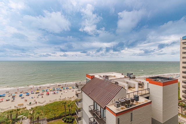 aerial view featuring a view of the beach and a water view