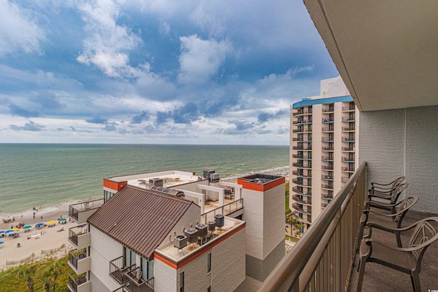 balcony with a view of the beach and a water view