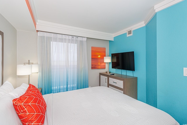 bedroom featuring ornamental molding