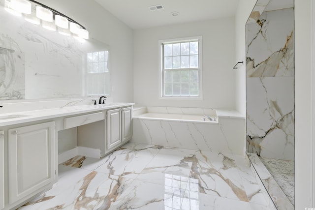 bathroom with tile patterned floors, shower with separate bathtub, and double vanity