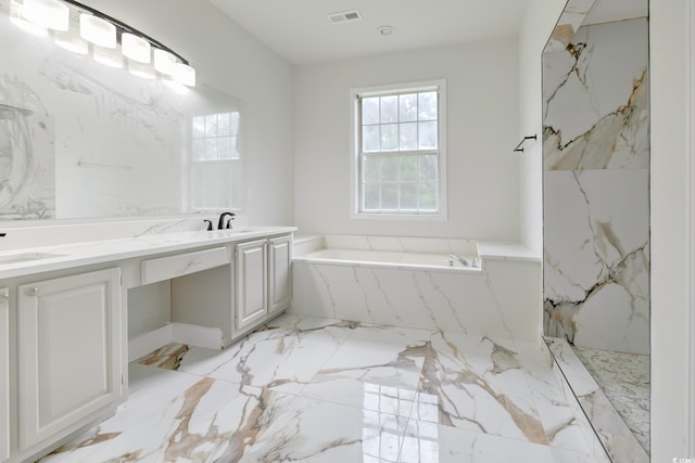 bathroom featuring marble finish floor, a marble finish shower, visible vents, vanity, and a bath