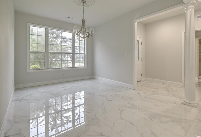 tiled empty room featuring a chandelier and ornate columns