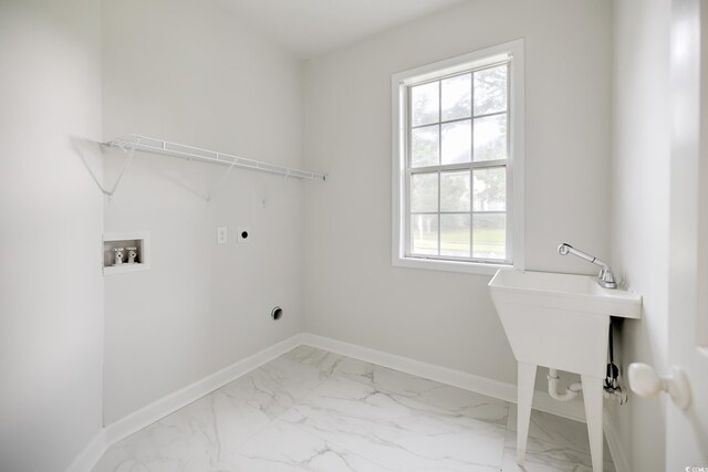 washroom with electric dryer hookup, tile patterned floors, washer hookup, and a healthy amount of sunlight