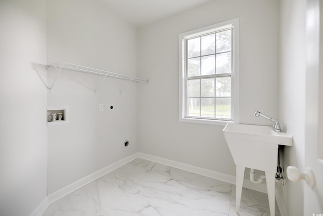 laundry room featuring laundry area, baseboards, hookup for a washing machine, marble finish floor, and electric dryer hookup