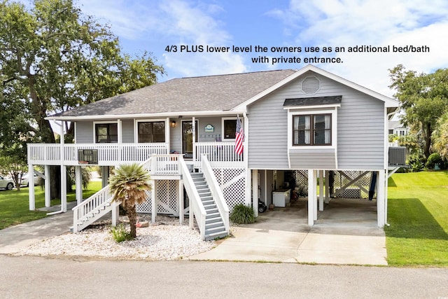 coastal inspired home with a carport, a porch, central air condition unit, and a front lawn