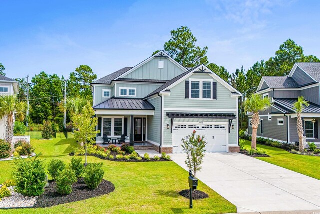 craftsman-style home featuring a garage and a front yard