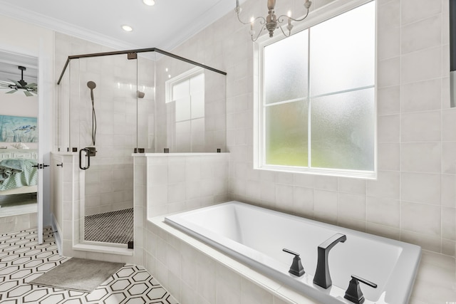 bathroom featuring tile walls, tile patterned floors, ornamental molding, and separate shower and tub