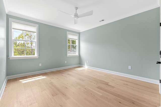 spare room with crown molding, ceiling fan, and light hardwood / wood-style floors