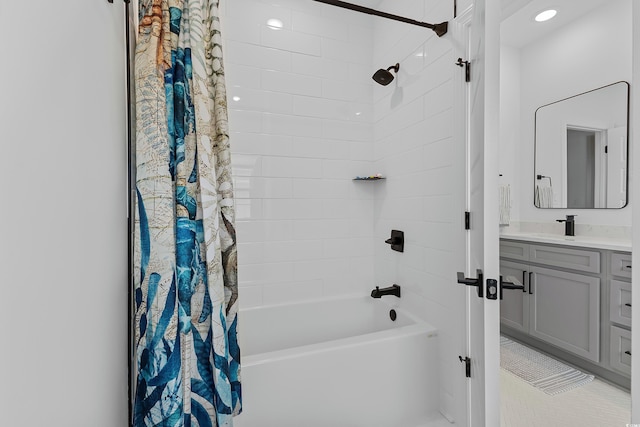 bathroom featuring vanity and shower / tub combo with curtain