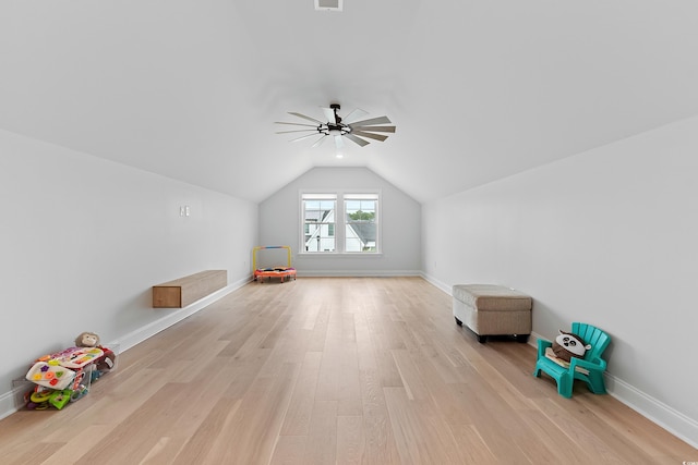 bonus room featuring vaulted ceiling and light wood-type flooring