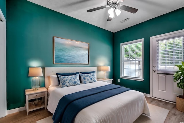 bedroom featuring light wood-type flooring and ceiling fan