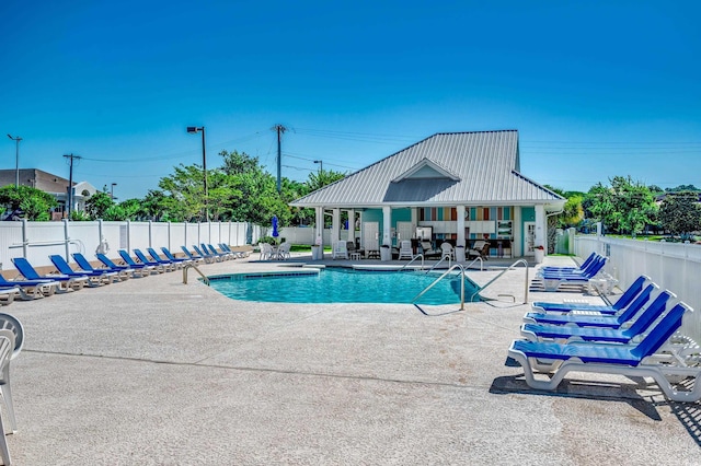 view of pool featuring a patio