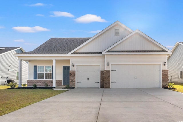 craftsman-style home featuring a garage and a front lawn