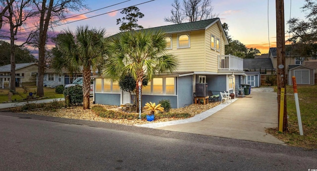 view of front facade with a storage unit