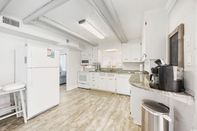 kitchen featuring a textured ceiling, white appliances, sink, light hardwood / wood-style floors, and white cabinetry