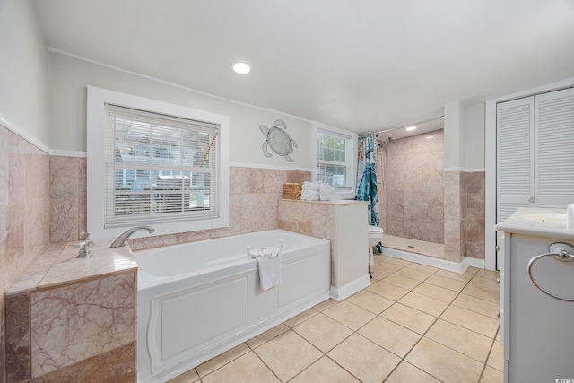 tiled bedroom featuring multiple windows, ceiling fan, and wooden walls