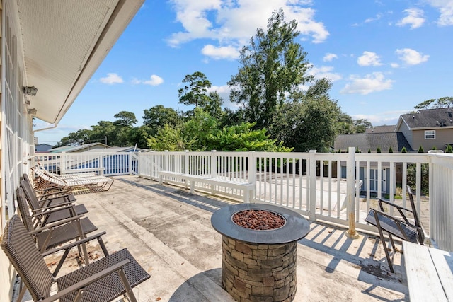 view of patio / terrace featuring an outdoor fire pit