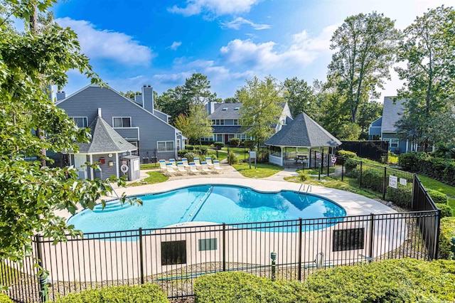 view of swimming pool with a gazebo and a patio