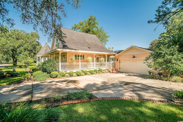 farmhouse-style home with driveway, a garage, and a porch