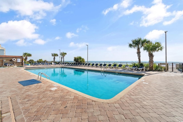 view of swimming pool with a patio area