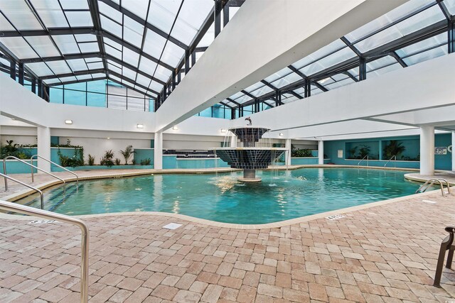 view of swimming pool featuring pool water feature