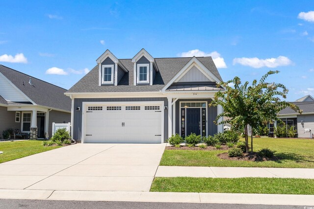 view of front of home featuring a garage and a front yard